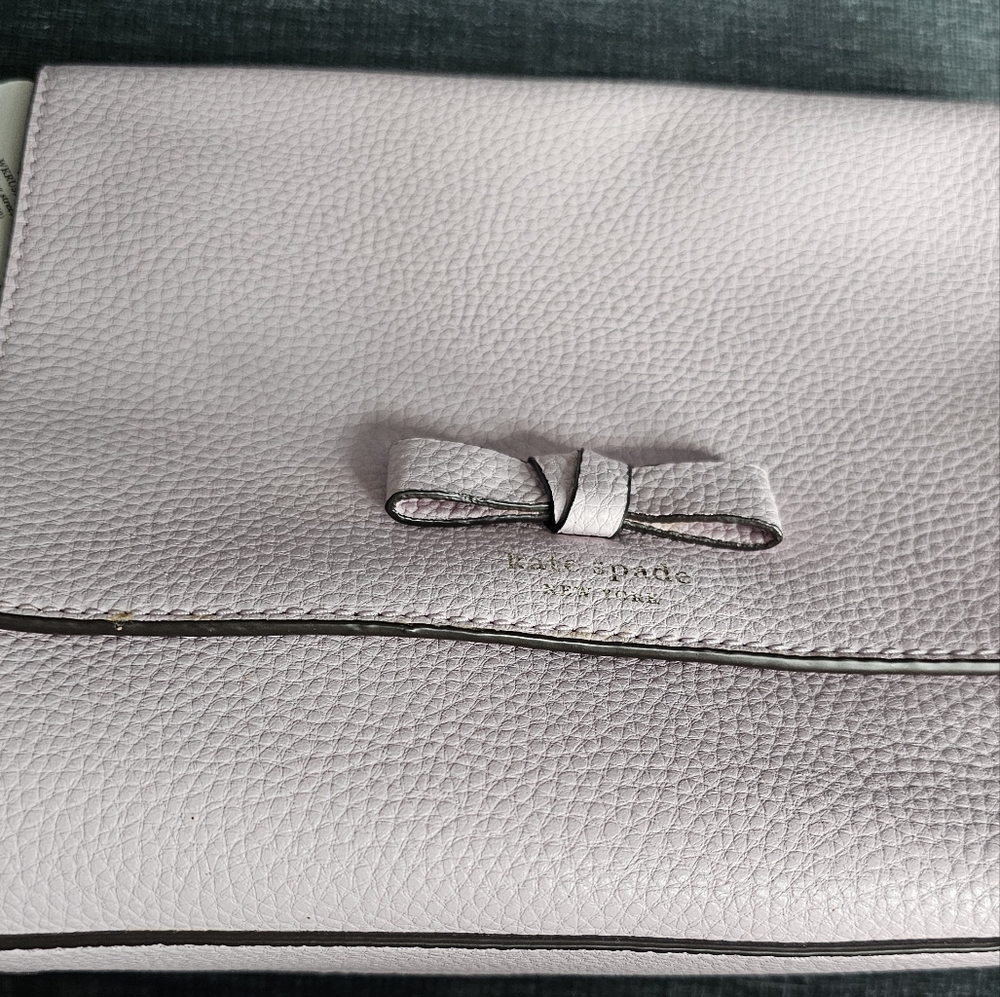 kate spade light pink pebbled leather clutch with bow detail